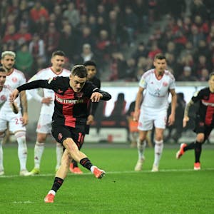 Bayer Leverkusen's German midfielder #10 Florian Wirtz shoots and scores the team's fourth goal during the German Cup (DFB-Pokal) semi-final football match between Bayer 04 Leverkusen and Fortuna Duesseldorf in Leverkusen, western Germany on April 3, 2024. (Photo by INA FASSBENDER / AFP) / DFB REGULATIONS PROHIBIT ANY USE OF PHOTOGRAPHS AS IMAGE SEQUENCES AND QUASI-VIDEO.