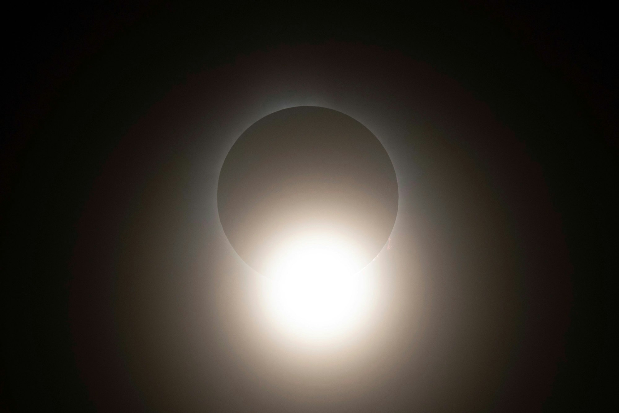 The moon partially covers the sun during a total solar eclipse seen from Progressive Field in Cleveland on Monday, April 8, 2024, before the Cleveland Guardians home opener baseball game against the Chicago White Sox. (AP Photo/Carolyn Kaster)