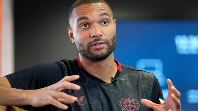 Bayer Leverkusen defender Jonathan Tah talks to The Associated Press during an interview at the BayArena in Leverkusen, Germany, Wednesday, April 24, 2024. Tah won the Bundesliga title already, and has also the chance to win the German Cup and the Europa League this season with Leverkusen. Tah is also defender for Germany's national team. (AP Photo/Martin Meissner)