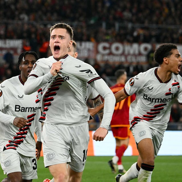 Bayer Leverkusen's German midfielder #10 Florian Wirtz celebrates with teammates after scoring his team first goal during the UEFA Europa League semi final first leg football match between AS Roma and Bayern Leverkusen at the Olympic stadium on May 2, 2024 in Rome. (Photo by Alberto PIZZOLI / AFP)