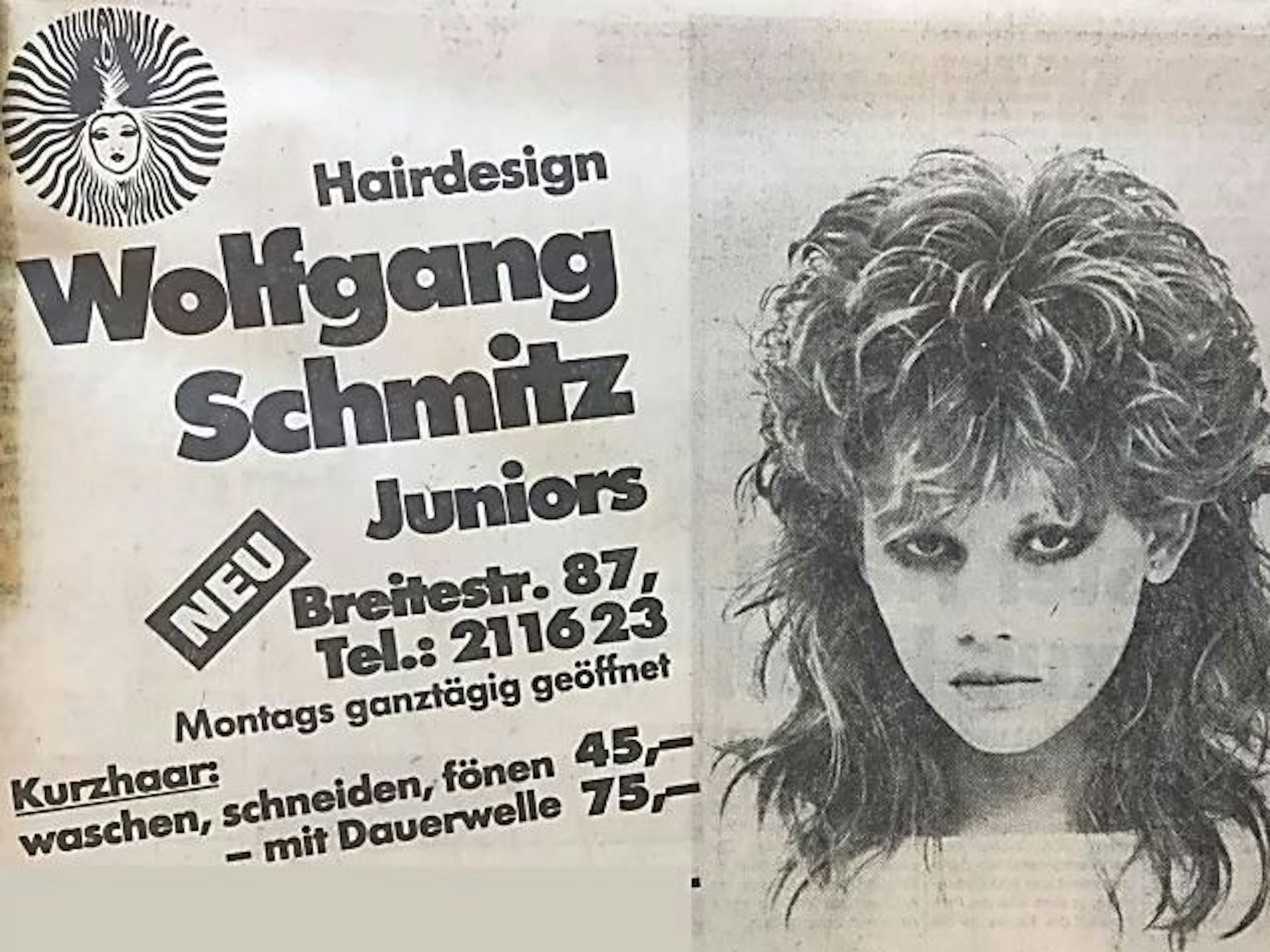 Das Foto zeigt Friseur-Werbung in Köln.