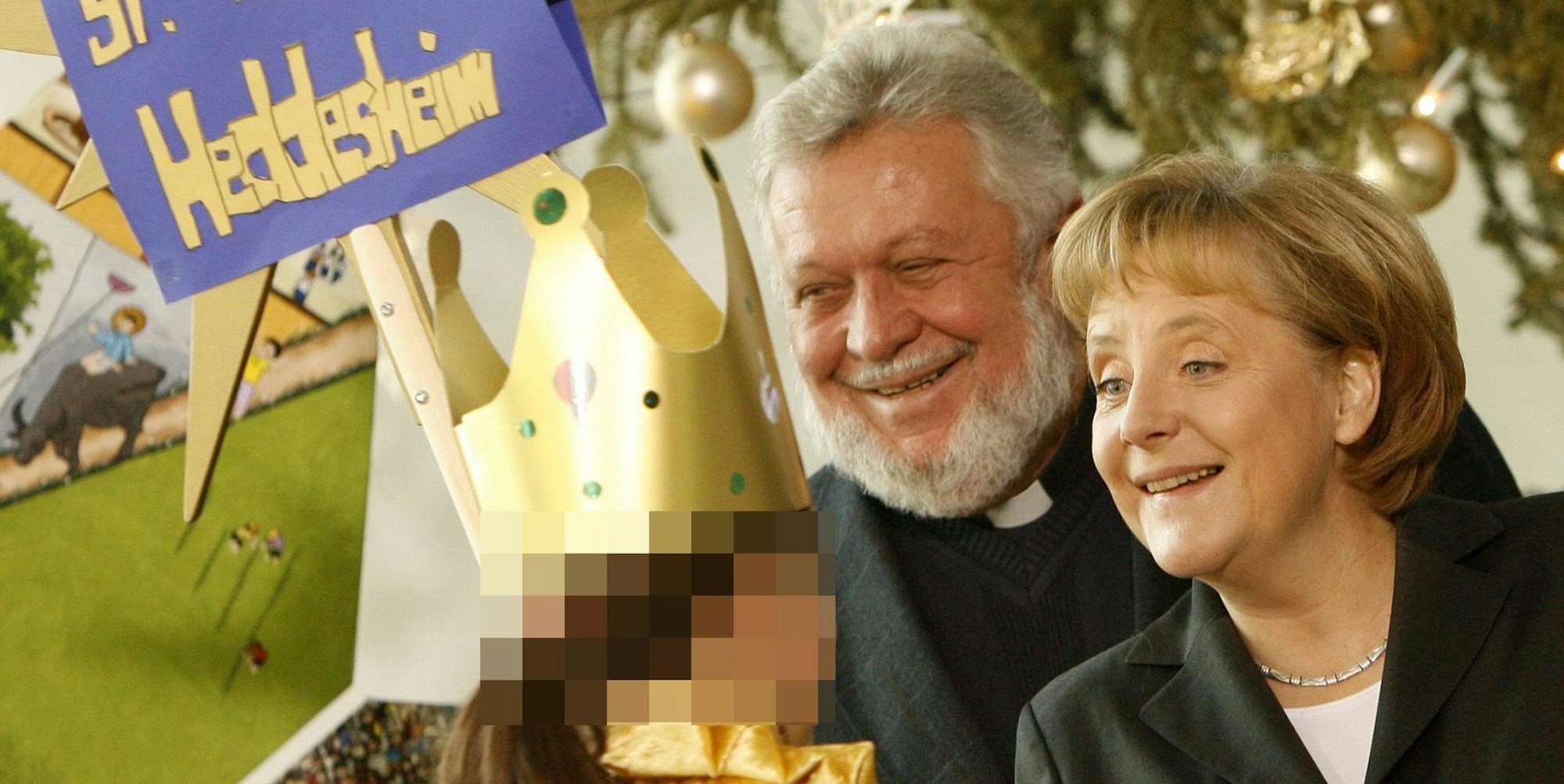 Die damalige Bundeskanzlerin Angela Merkel und der damalige Präsident der Sternsinger, Winfried Pilz, im Januar 2008 im Kanzleramt.