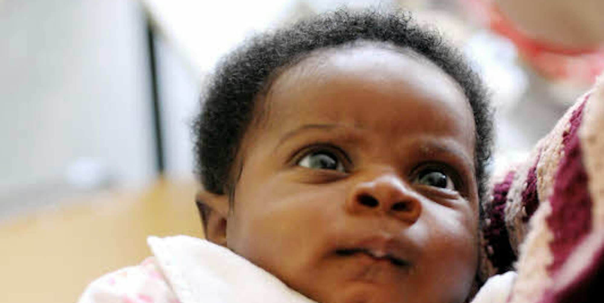 Baby David wird im Flüchtlingszentrum „Fliehkraft“ betreut, während seine Mutter Deutsch lernt.