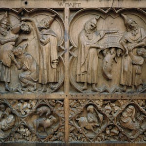 Eine antisemitische Darstellung im Chorgestühl des Doms: Menschen mit „Judenhüten“ laben sich an einer Sau, als Zeichen der Völlerei und Wollust.