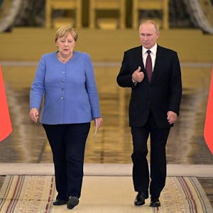 Putin Merkel afp