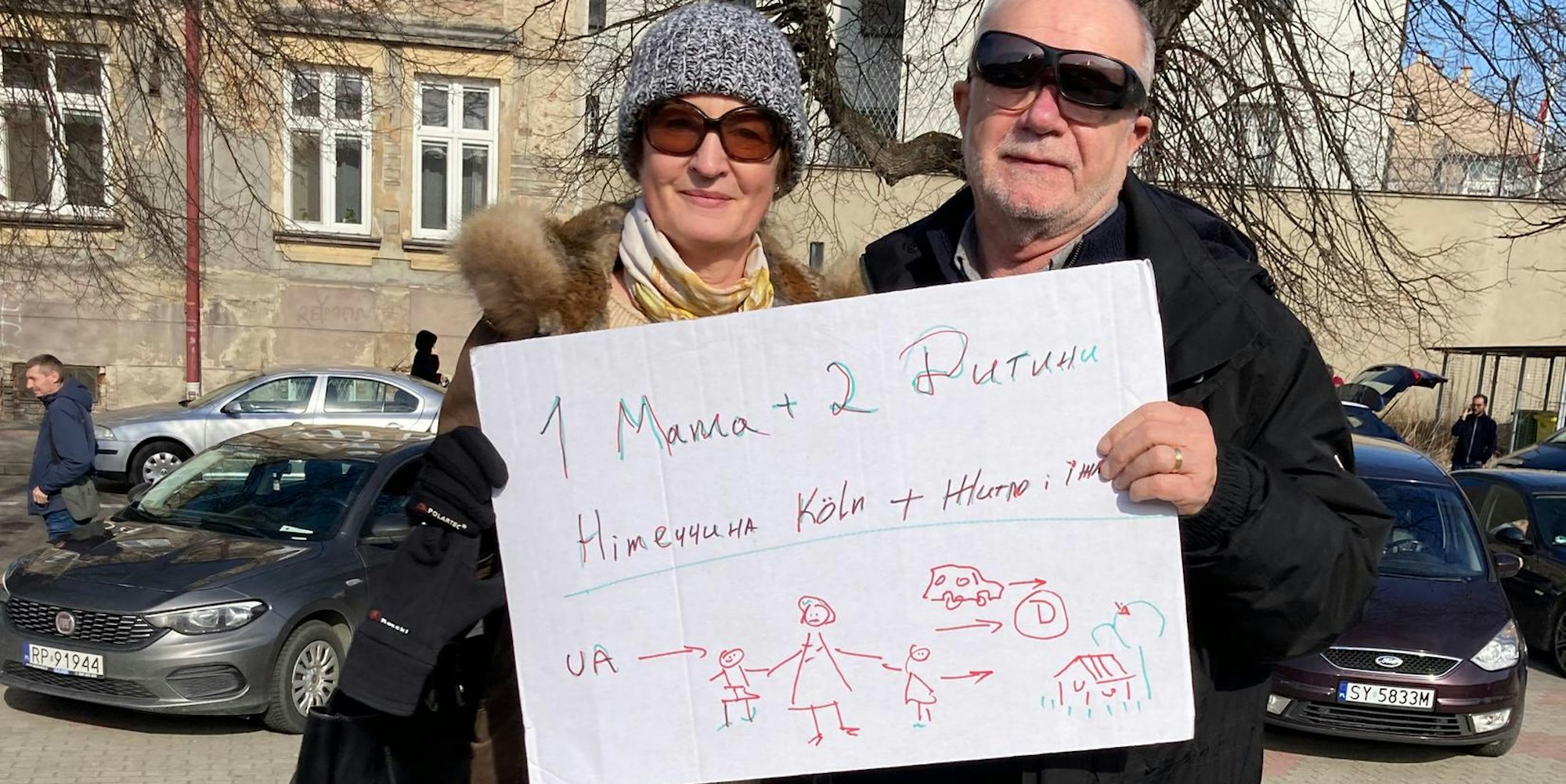 Mit diesem Schild boten Guy und Sylvie Féaux de la Croix drei Flüchtlingen an, sie mitzunehmen.